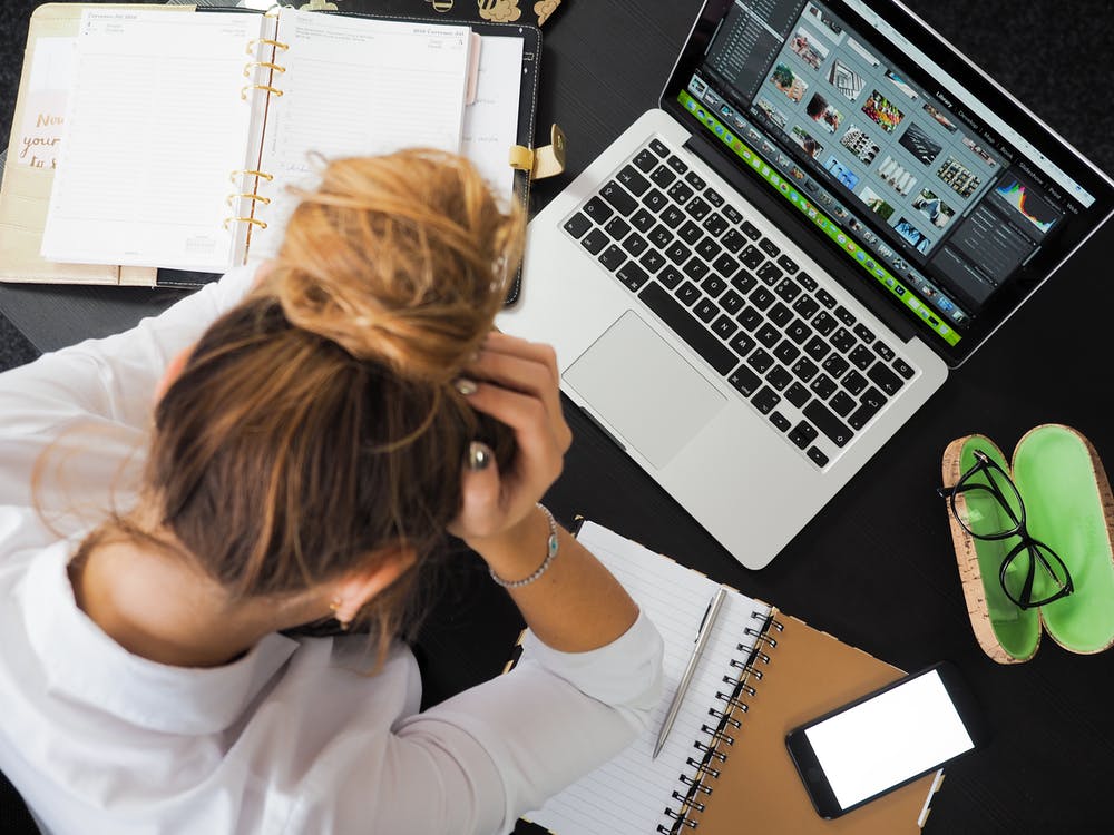 Women stressed at her laptop